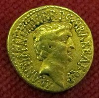 Zlatni aureus kojega je sa svojim likom izdao Marko Antonije 41. pr. Kr. s natpisom M ANT IMP AVG III VIR R P C M BARBAT Q P