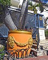 Orange and gold planters outside Versace Mansion