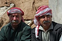 Yazidi men wearing keffiyehs