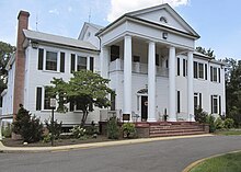 A white mansion with columns