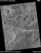 Wide view of a surface with lines of pits, as seen by HiRISE under HiWish program