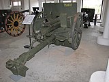 An Ehrhardt 7.5 cm Model 1901 with pole trail, spoked wooden wheels, gun shield and recoil spade. This is a typical WWI era, horse-drawn, direct fire, field gun.