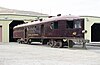 Burgundy railcar with a wedge-shaped nose