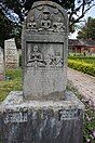 Nishidhi, a 14th century memorial stone depicting the observance of the vow of Sallekhana with old Kannada inscription. Found at Tavanandi forest, Karnataka, India