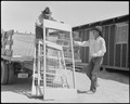 Apaches assisting in the unloading of beds for Japanese internees at the Poston War Relocation Center on April 29, 1942.