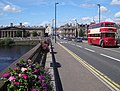 South Street crossing Queen's Bridge, with Perth Sheriff Court, the former site of the Gowrie House, in view on the left. 1–3 South Street is on the right