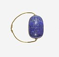 Ancient Egyptian scarab finger ring; 1850–1750 BC; lapis lazuli scarab set in gold plate and on a gold wire ring lapis-lazuli; diameter: 2.5 cm, the scarab: 1.8 cm; Metropolitan Museum of Art