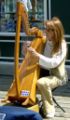 A street musician from Quebec City plays the harp