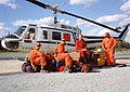 A contract Bell 205A-1 with its MNR helitack firefighting crew on standby at Sioux Lookout, Ontario, 1995