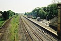 The two fast tracks as they existed prior to 2017, on the left, passing either side of the outline of the platform never built.