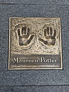 Bronze cast of hand prints and the name Maureen Potter