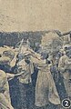 The People's Volunteer Army sends bundles of wheat to the home of an old North Korean woman