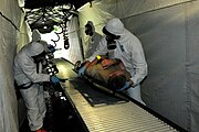 A team of Polish and American Soldiers practice decontamination procedures during a training exercise in Poland