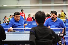 Carlos Raul Maslup and Daniel Haylan playing paragraph table tennis vs. Korea