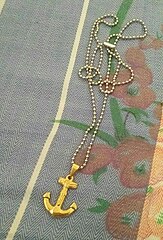 An anchored cross necklace