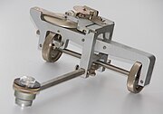A linear planimeter. Wheels permit measurement of long areas without restriction.