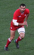 Georgian rugby player with Borjgali on his shorts and shirt