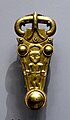 Finglesham buckle, showing the naked pagan God Woden with spears, horned helmet, belt buckle.