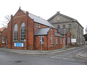The red brick extension behind the main chapel