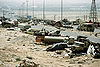 Demolished vehicles line Highway 80, also known as the "Highway of Death", the route fleeing Iraqi forces took as they retreated fom Kuwait during Operation Desert Storm