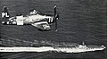 An F8F-2P over USS Midway 1949/50
