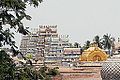 Image 13The golden Vimana over the sanctum at Srirangam midst its gopurams, its gable with Paravasudeva image. (from Tamils)