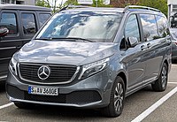 Front three-quarters view of a silver minivan