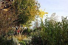 Trees, grasses and two sculptures aboard a former offshore platform converted into an art installation.