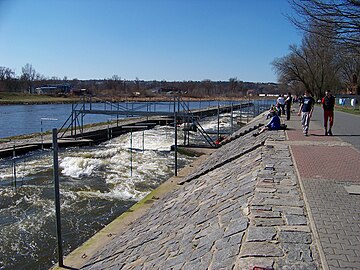 The mid-course bridge and below. For competitions, the sloped right bank is covered with seating.