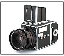 image of a medium format Hasselblad camera with the viewfinder open.