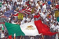 Protesters carry the mexican flag during a May 1 2006 boycott march