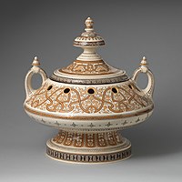 "Henri II ware" meets Islamic style in this pot-pourri vase by Charles Toft, 1871. This decoration is painted rather than inlaid.[23]