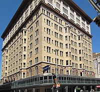 Color photo of multi-floor building taken from street level