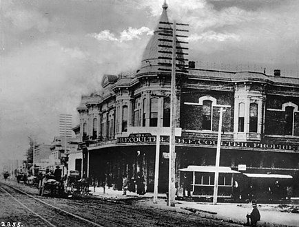 View south on Spring at 2nd, Hollenbeck Block when it was two stories, Coulter's store, 1886