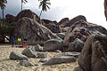 Huge boulders litter the beach at The Baths