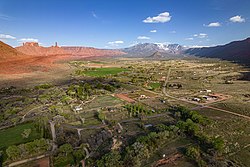 Castle Valley sits next to Castleton Tower, Round Mountain, and in the distance, the La Sal Mountains, April 2021