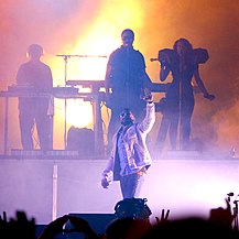 Kanye West performing at The Virgin Mobile Festival.