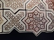 Lustre tiles from Iran, probably Kashan, 1262, in the shapes of the Sufi symbols for the divine breath