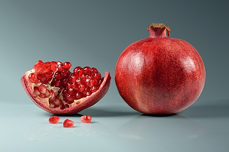 Pomegranate, whole and piece with arils, by Iifar