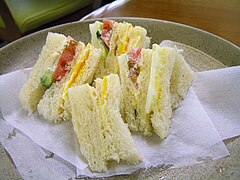 Crustless English sandwiches on a plate