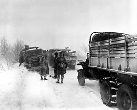 Army vehicles coping with snow during the Battle of the Bulge of World War II