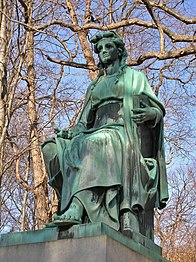 The statue, Wisdom, on the Benedict Family Monument was designed by Truman Howe Bartlett and sculpted by Ferdinand von Miller
