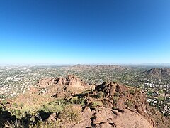 View from south end of summit showing formations as well as distant Piestewa Peak (background, center).