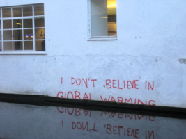 Grafitti "I don't believe in global warning", half-flooded