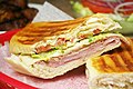Image 8A Cuban sandwich is a variation of a ham and cheese sandwich that originated among the Cuban workers in the cigar factories in Key West, Florida[1][2]