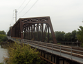 The Baltimore and Ohio Railroad Bridge, built in the late 19th or early 20th century as a two track, swing bridge across the Schuylkill River in the Grays Ferry neighborhood in Philadelphia, Pennsylvania. Now a CSX Philadelphia Subdivision bridge. View from the CSX Philadelphia Terminal, looking southwest.