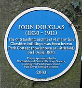 A circular blue plaque reading "JOHN DOUGLAS (1830–1911 the outstanding architect of many fine Cheshire buildings was born here at Park Cottage (now known as Littlefold) on 11 April 1830. Plaque sponsored by the Northwich and District Heritage Society, Cuddington Parish council and Vale Royal Borough Council 2003