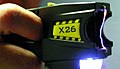 A Taser X26 making an electrical arc between its two electrodes