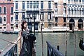 Young woman in Venice, Italy, 1990, wearing a silk tank top, and a wide cinch-belt.