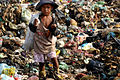 A poor child at a landfill site